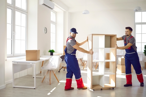 Smiling Carriers Help Customer With Furniture During Relocation And Moving business movers in San Diego